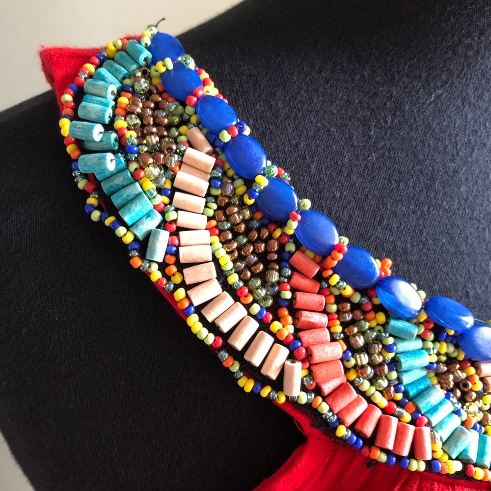 Orange top with beautiful beads attached to it